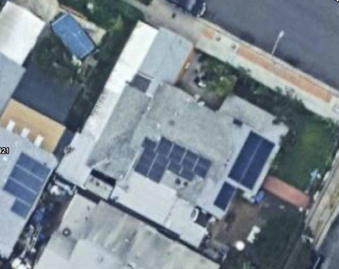 Satellite image of a home with solar panels installed on the roof